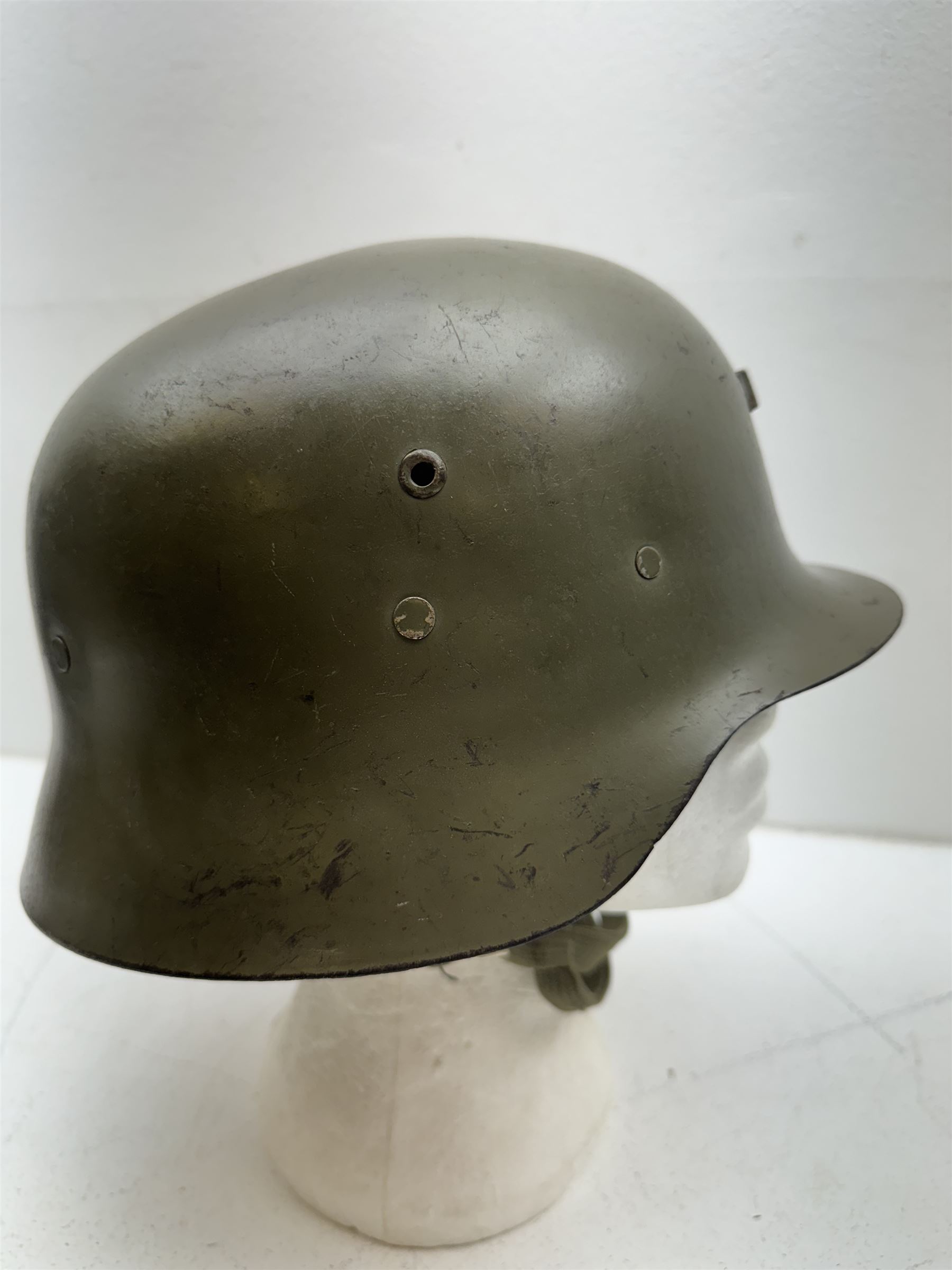WWII Spanish combat steel helmet model Z, with leather lining and canvas strap, interior D22cm 