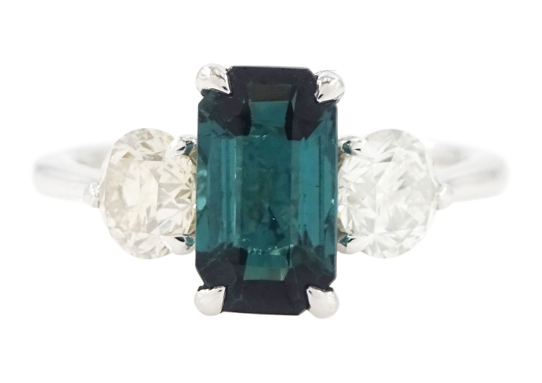 Platinum green tourmaline and diamond three stone ring, single octagonal cut tourmaline of 1.54 carat, with a single round brilliant cut diamond set either side, stamped Plat 950, total diamond weight 1.06 carat