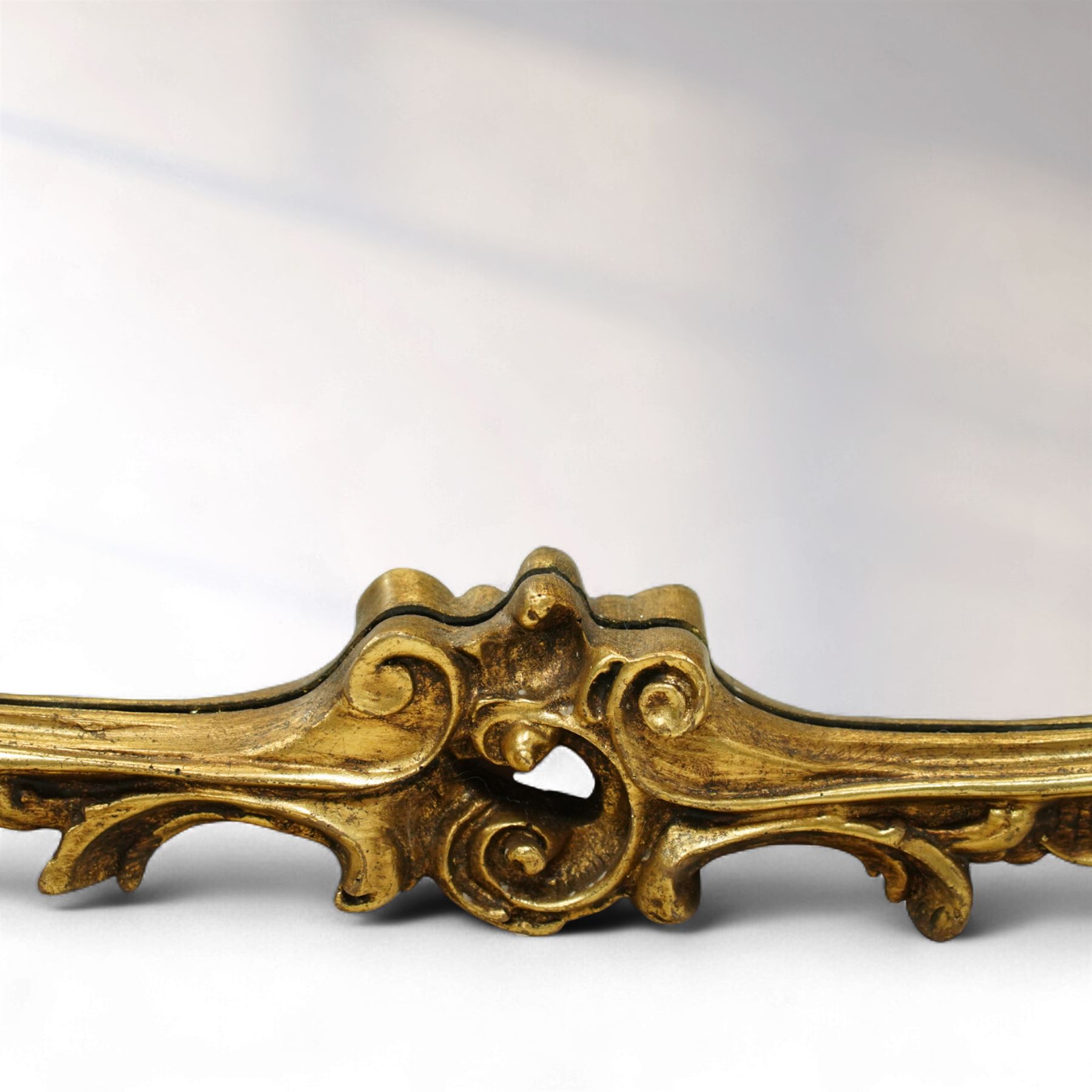 Contemporary Rococo revival style gilt overmantel mirror, shaped rectangular mirror plate with scrolling acanthus and rocaille frame, sides with inset Wedgwood style portrait plaques 