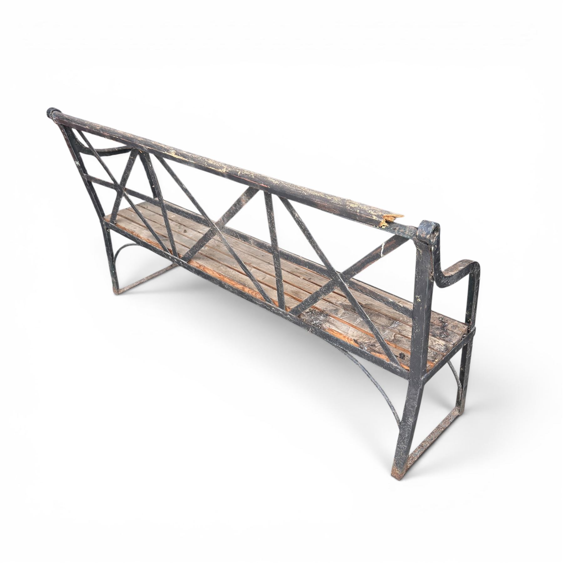 19th century and later Estate made wrought iron strapwork garden bench, the weathered wooden cresting rail over X-form strapwork back and slatted wooden seat