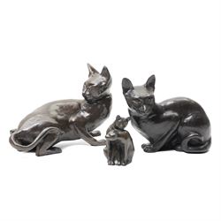 Two Seneshall bronzed resin cats, signed, W21cm and 23cm; together with a bronze effect mo...