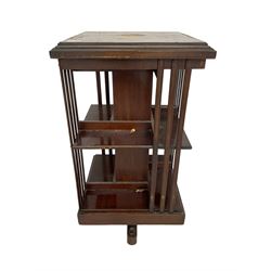 Edwardian inlaid mahogany revolving bookcase, moulded square top with satinwood band over three tiers with moulded uprights