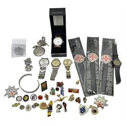 Three Sekonda wristwatches, together with other wristwatches, enamel badges and collectable badges
