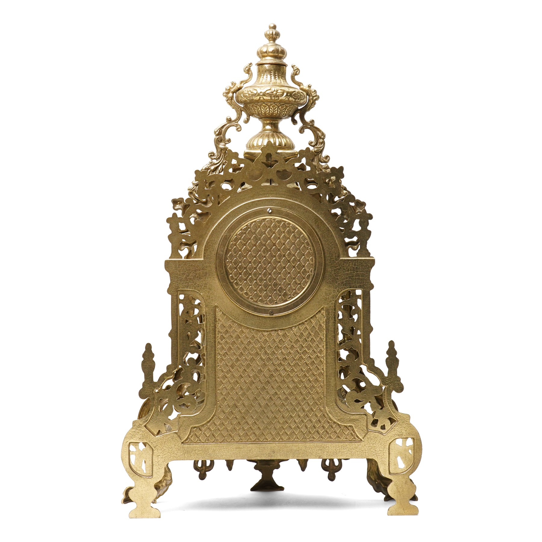 19th century design mantel clock, the brass dial with porcelain numerals, bell strike in brass case of rococo design with urn finial H60cm