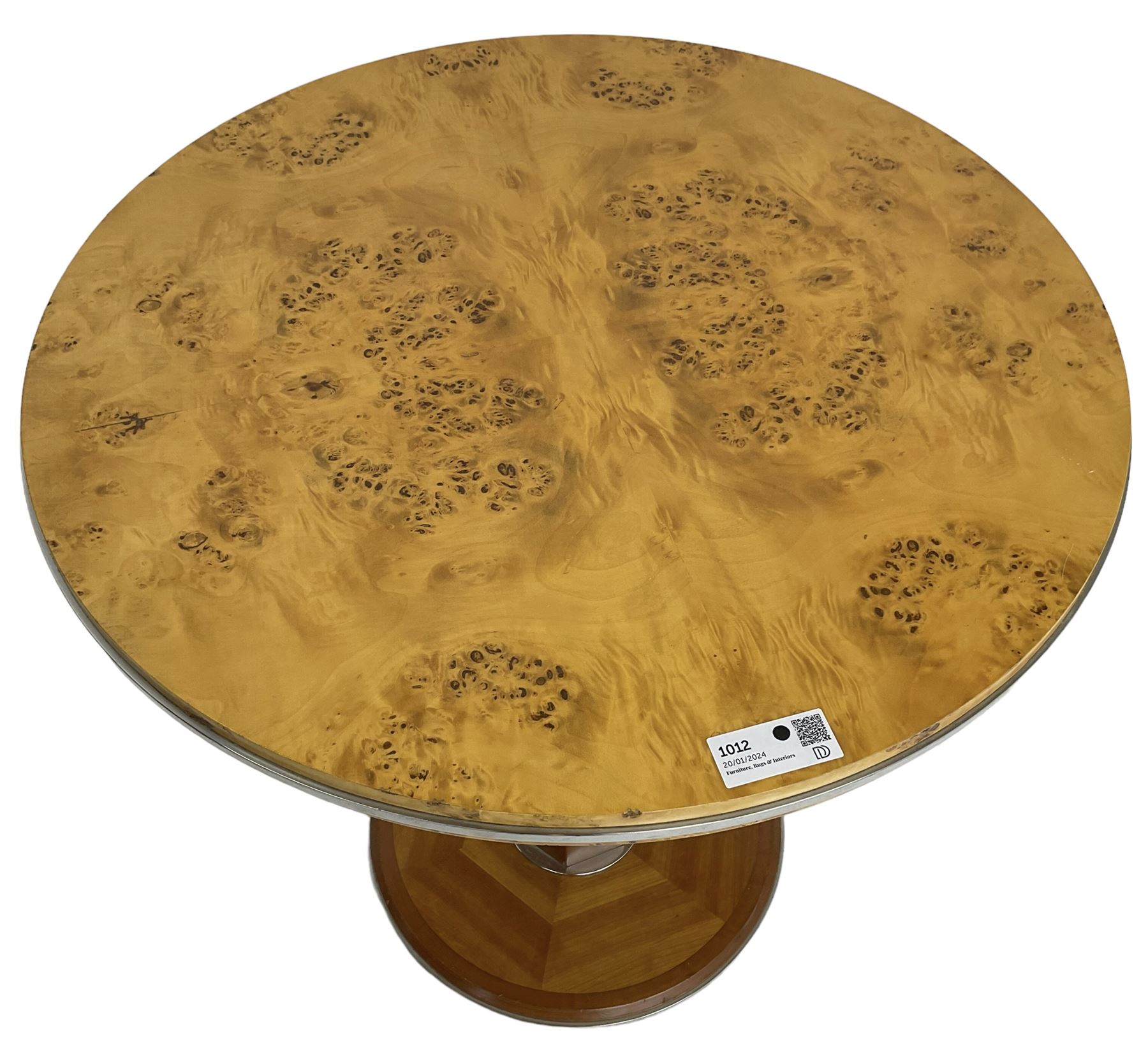 Art Deco design maple and cherry wood pedestal table, circular top with figured quarter matched veneers, mounted by chromed metal band, octagonal pedestal on circular platform base
