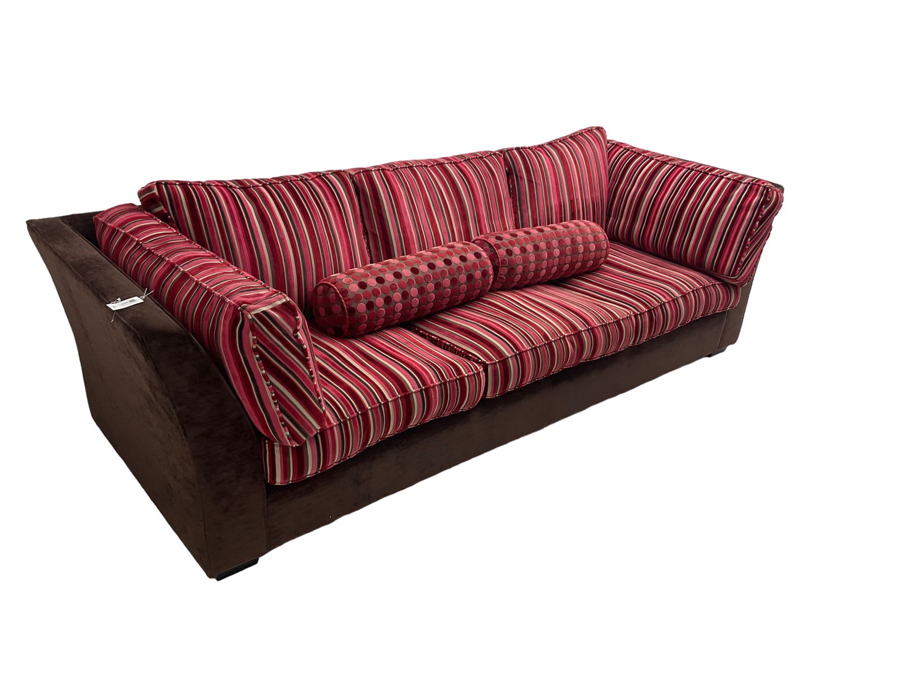 Collins & Hayes - grande three seat sofa upholstered in chocolate fabric, the loose cushions upholstered in textured fuschia stripes with contrasting spotted bolster cushions