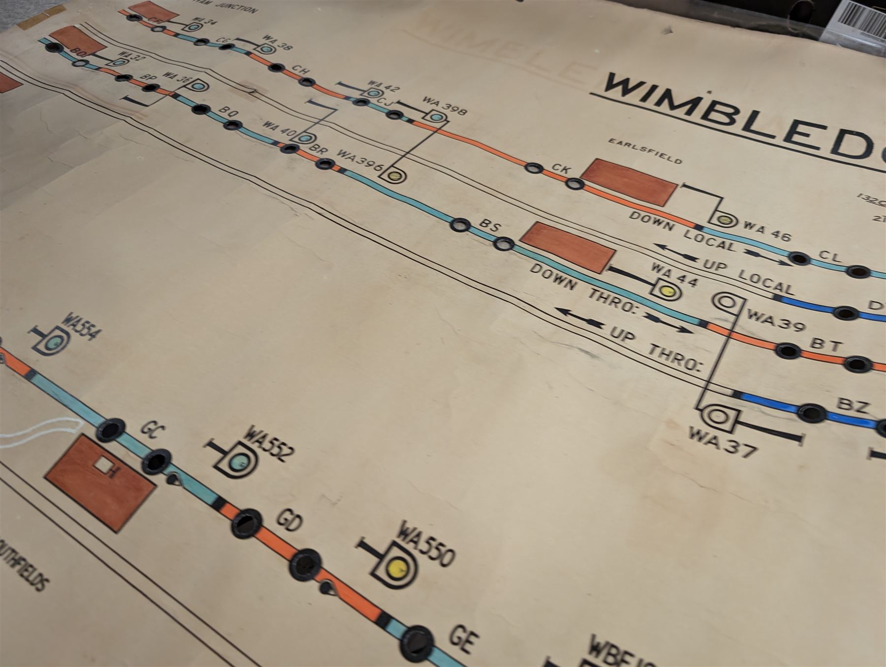Collection of railway signal maps and similar, including a Wimbledon example, approx 350cm long, together with a collection of book pages depicting images of locomotives