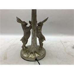 Silver composite table lamp, modelled as a pair of boxing hares, with a grey velvet shade, H45cm