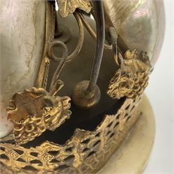 Victorian evening dinner bell, with three mother of pearl shells, floral and grape gilt decoration, and bird finial, raised upon a circular soapstone base with gilt pierced gallery, H14cm