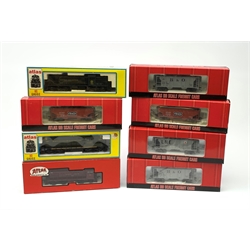 Atlas HO scale - three locomotives comprising Lehigh Valley Alco-S2 Diesel Switcher No.158, Norfolk & Western 7076 RS-3 Diesel No.305 and Canadian National 8228 GP-7 Diesel No.1720; three Baltimore & Ohio PS-2 Covered Hopper wagons; and two Frisco 2-Bay Offset Side Hopper wagons, all boxed and virtually mint (8)