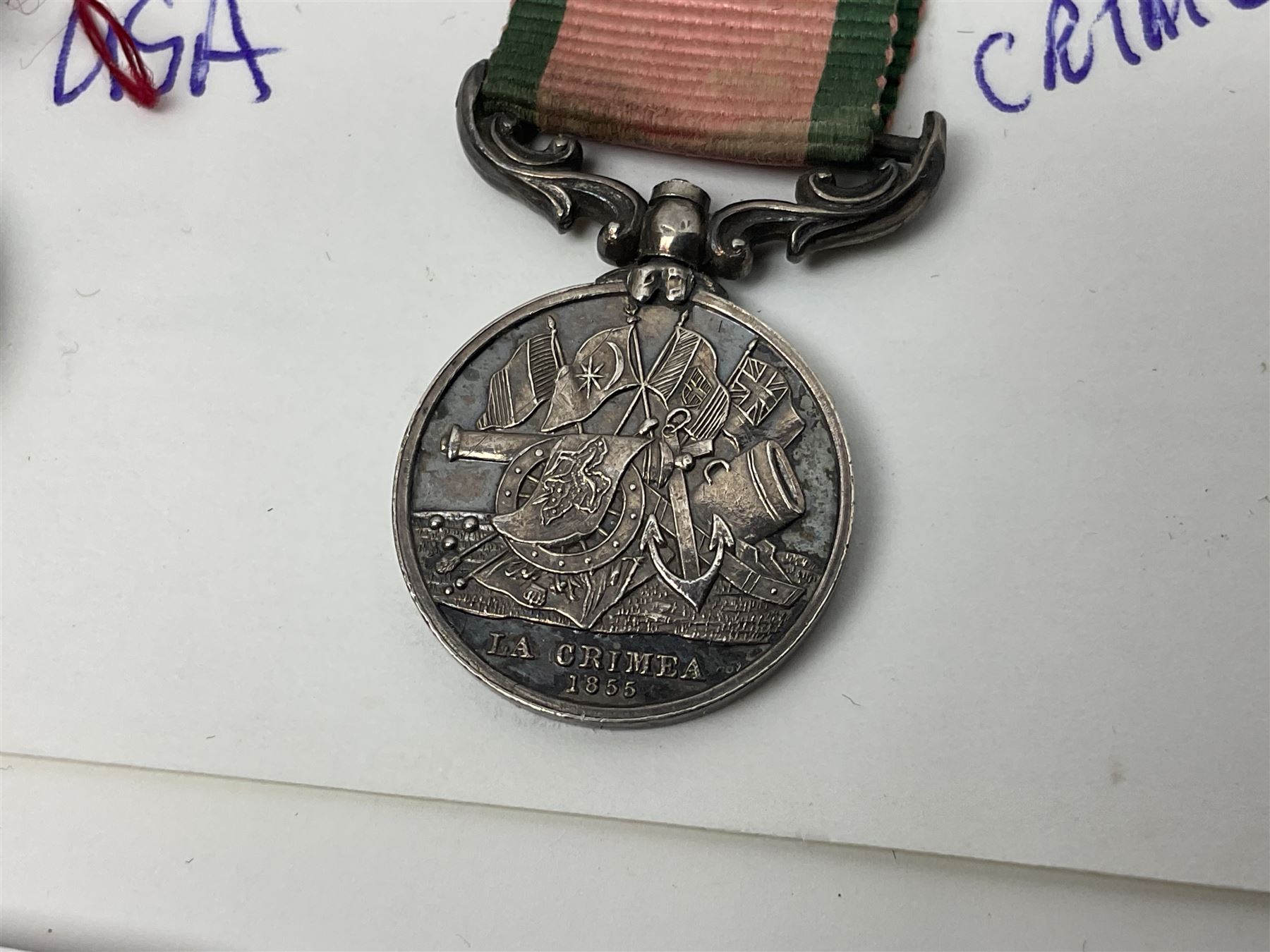 Eleven medal miniatures including Turkish Crimea, OBE (Civil), WW2 Burma Star and France/Germany Star, two pairs of WW2 War/Defence medals, LSGC etc; and two military badges