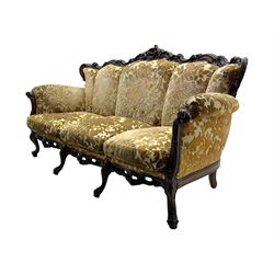 Victorian design stained wood three seater settee, top rail carved and scrolled, padded back and arms, scrolled cabriole feet 