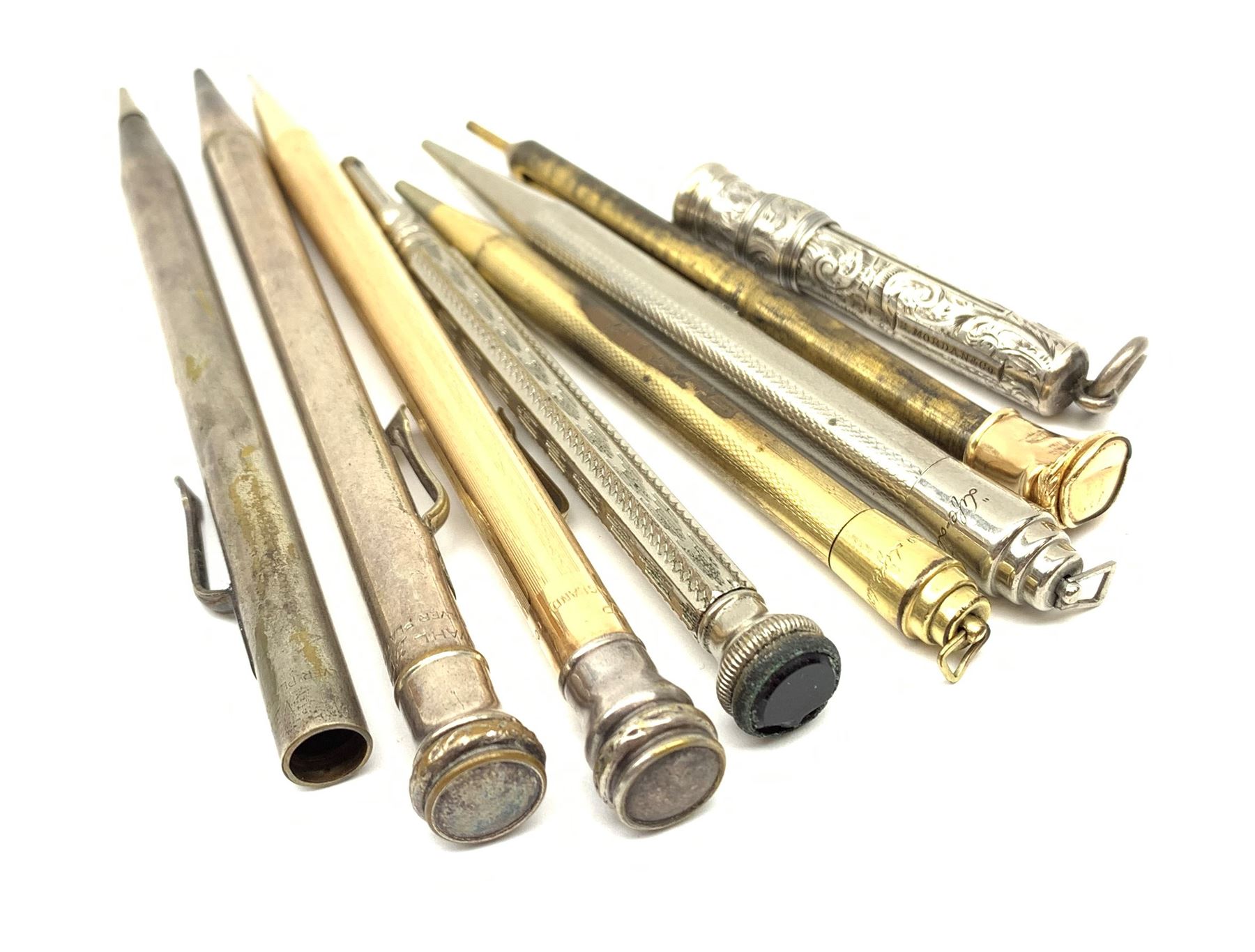 A late Victorian Sampson Mordan & Co silver push action propelling pencil, with foliate engraved decoration and suspension ring terminal, hallmarked Sampson Mordan & Co, London 1896, together with a group of vintage pens including examples by Eversharp, a number marked Silver Plated, Rolled Gold, and Gold Filled. 