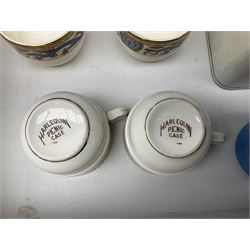 Vintage Harlequin picnic case, with tin sandwiches boxe, ceramic cups, plates, bowls and flatware for four settings, L48cm, H30cm