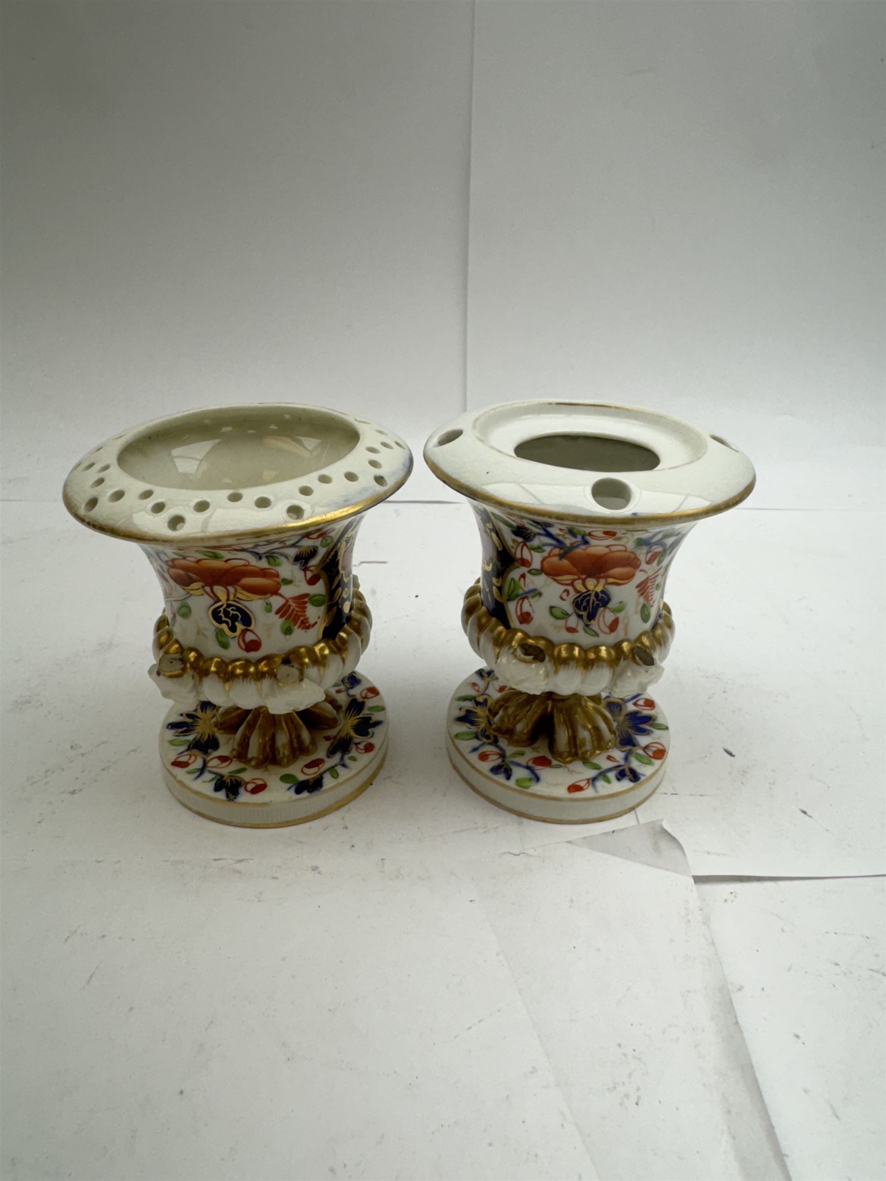 Pair of Staffordshire figures modelled as chained Dalmatians seated upon cobalt blue oval bases, H13cm, together with a Staffordshire pastille burner modelled as a castle, H12cm, a pair of 19th century Derby potpourri pots (lacking covers), and an 18th century blue and white tea bowl 