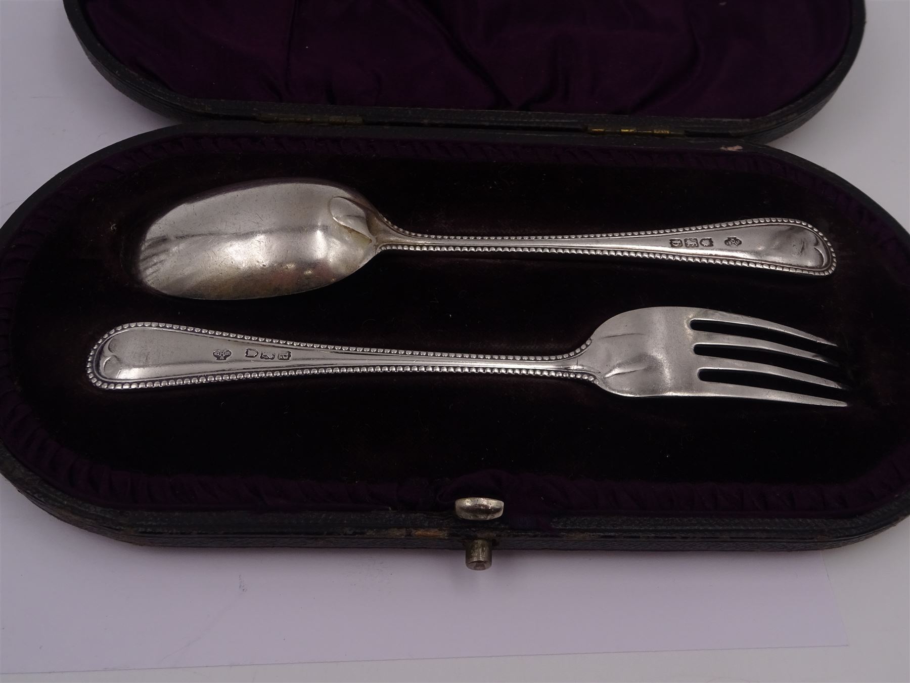 Victorian silver five bar toast rack, hallmarked Stokes & Ireland Ltd, together with Victorian silver fork and spoon set, each with beaded rims, hallmarked London 1896, William Hutton & Sons Ltd, toast rack H8cm