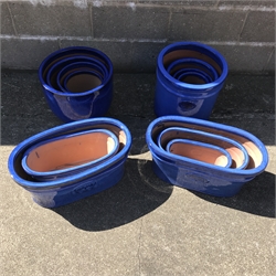  Five graduating glazed ceramic traditional cylinder pots, five egg pots and five traditional troughs (15)  