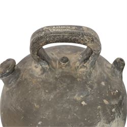 Four 20th century Spanish blackened earthenware botijo or cruche vessels, each of typical baluster form with central loop handle and opposing spout, impressed marks to handles, tallest example H31cm