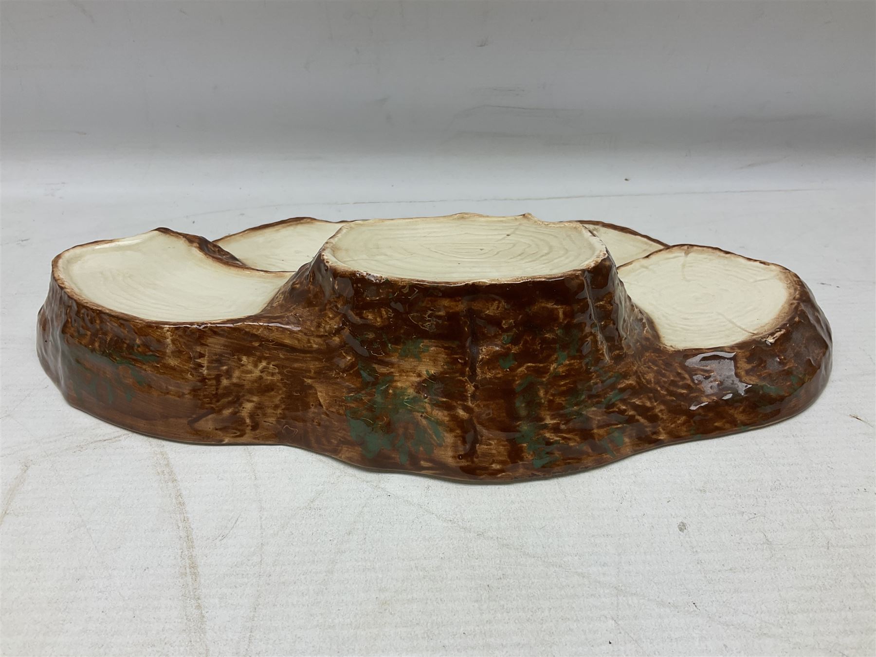 Seven Beswick Beatrix Potter figures, comprising Sally Henny Penny, Johnny Town-Mouse, Mrs Tiggy-Winkle, Mrs Tittlemouse, Tom Kitten, Pig-Wig and Squirrel Nutkin, together with a Beswick tree trunk display stand, stand L30cm