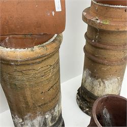 Three early 20th century circular chimney pots and a double chimney pot - THIS LOT IS TO BE COLLECTED BY APPOINTMENT FROM DUGGLEBY STORAGE, GREAT HILL, EASTFIELD, SCARBOROUGH, YO11 3TX