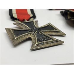 WWII German Iron Cross 2nd Class, the suspension ring stamped 128 for S. Jablonski G.m.b.H. Posen; with ribbon; together with an embroidered cloth eagle badge and quantity of German medal ribbons.