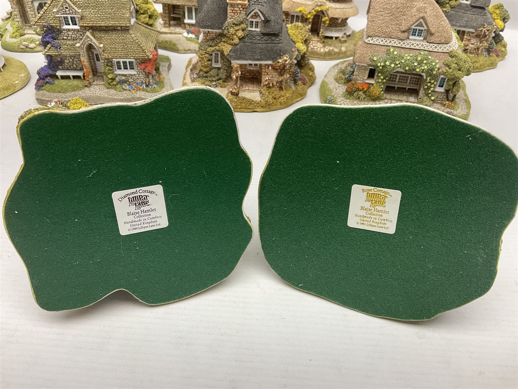 Eight Lilliput Lane limited edition Beatrix Potter models, including Buckle Yeat, Tabitha Twitchits Shop and Ginger Pickles Shop, together with twelve Lilliput Lane models from the Blaise Hamlet collection, including Dial Cottage, Diamond Cottage and Vine Cottage, all with deeds and original boxes (20)