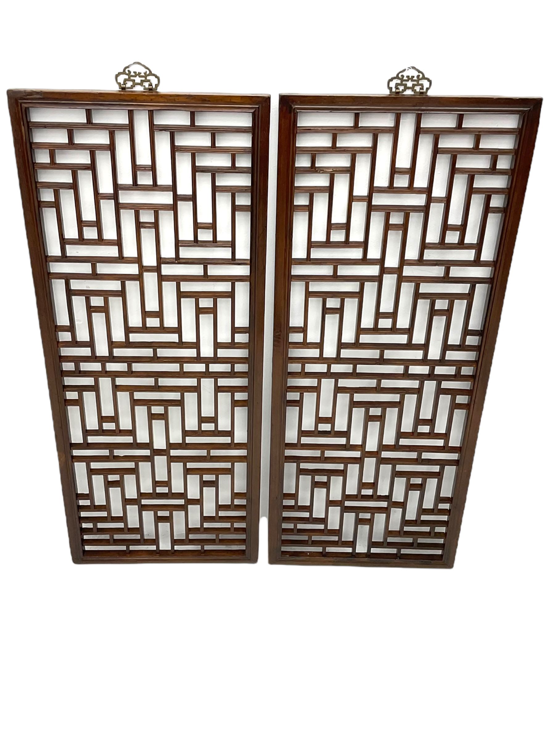 Pair 19th century Chinese lattice wall panels, in moulded frames with metal hangers, the lattice work with reed moulding