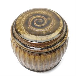 Mike Dodd (1943-): Covered studio pottery storage jar, of fluted barrel form, impressed marks to foot, H20cm 