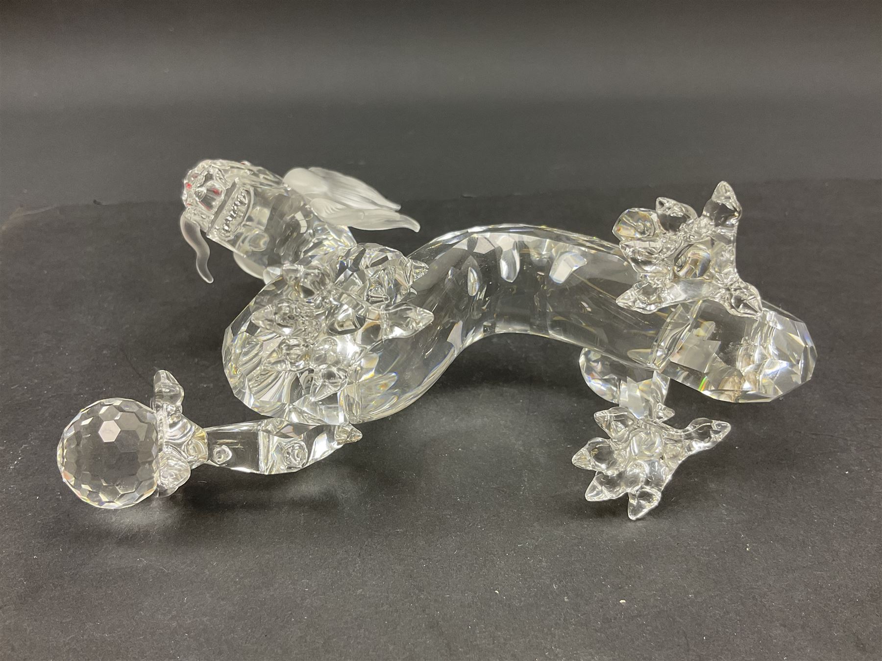 Two Swarovski Crystal Signs of the Zodiac figures, comprising horse and tiger, together with Zodiac dragon holding the flaming pearl, largest H11cm 