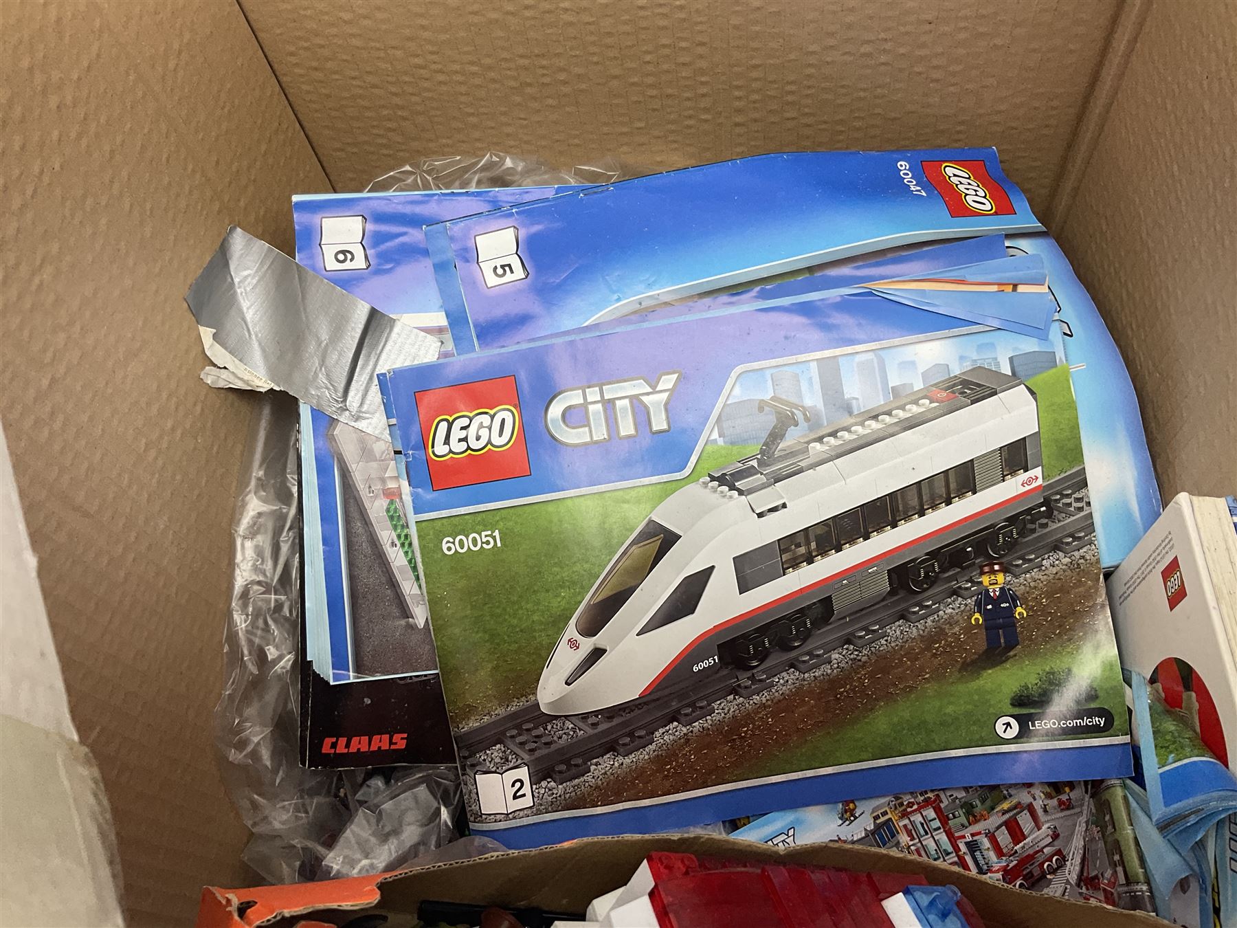 Very large collection of Lego, predominantly loose but some part constructed models, including Lego City, Lego Technic, Chima, Arctic 5, train set, mobile crane etc; together with numerous instruction booklets and some empty boxes; contained in two large cardboard boxes with gross weight of over 24kgs