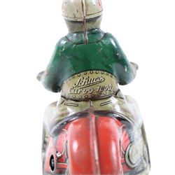 Schuco Curvo 1000 tinplate clockwork motorcycle, in red and cream, with rider in green jacket