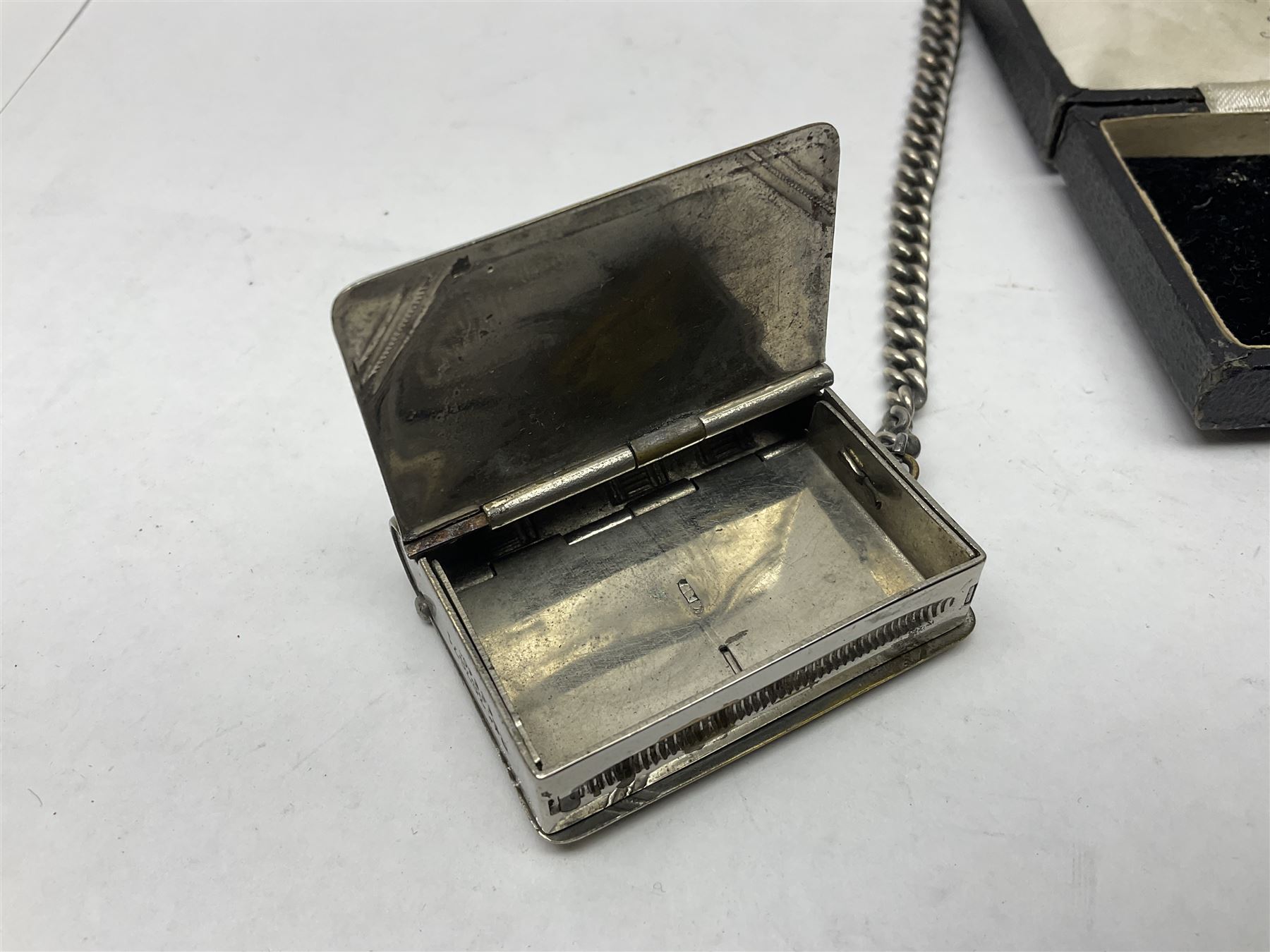 9ct rose gold mourning pin, decorated with an eye and a masonic symbol behind a glazed panel, toghether with a silver albert chain, with silver fob, silver cheroot holder, plated vesta case in the form of a book and a gentleman's Glycine wristwatch