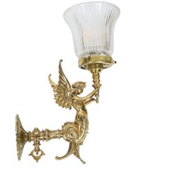 Pair of Victorian style wall sconces, each modelled as a caryatid supporting a single light fitting in one raised arm, with tapering and fluted clear glass shade, approximately H31cm D21cm