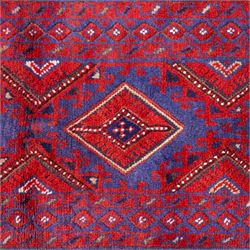 Afghan Meshwani runner, hand-knotted wool pile, indigo ground decorated with a vertical series of angular diamond medallions in tones of madder red, dark blue, framed by geometric borders with flatwoven kilim ends with fringe 
