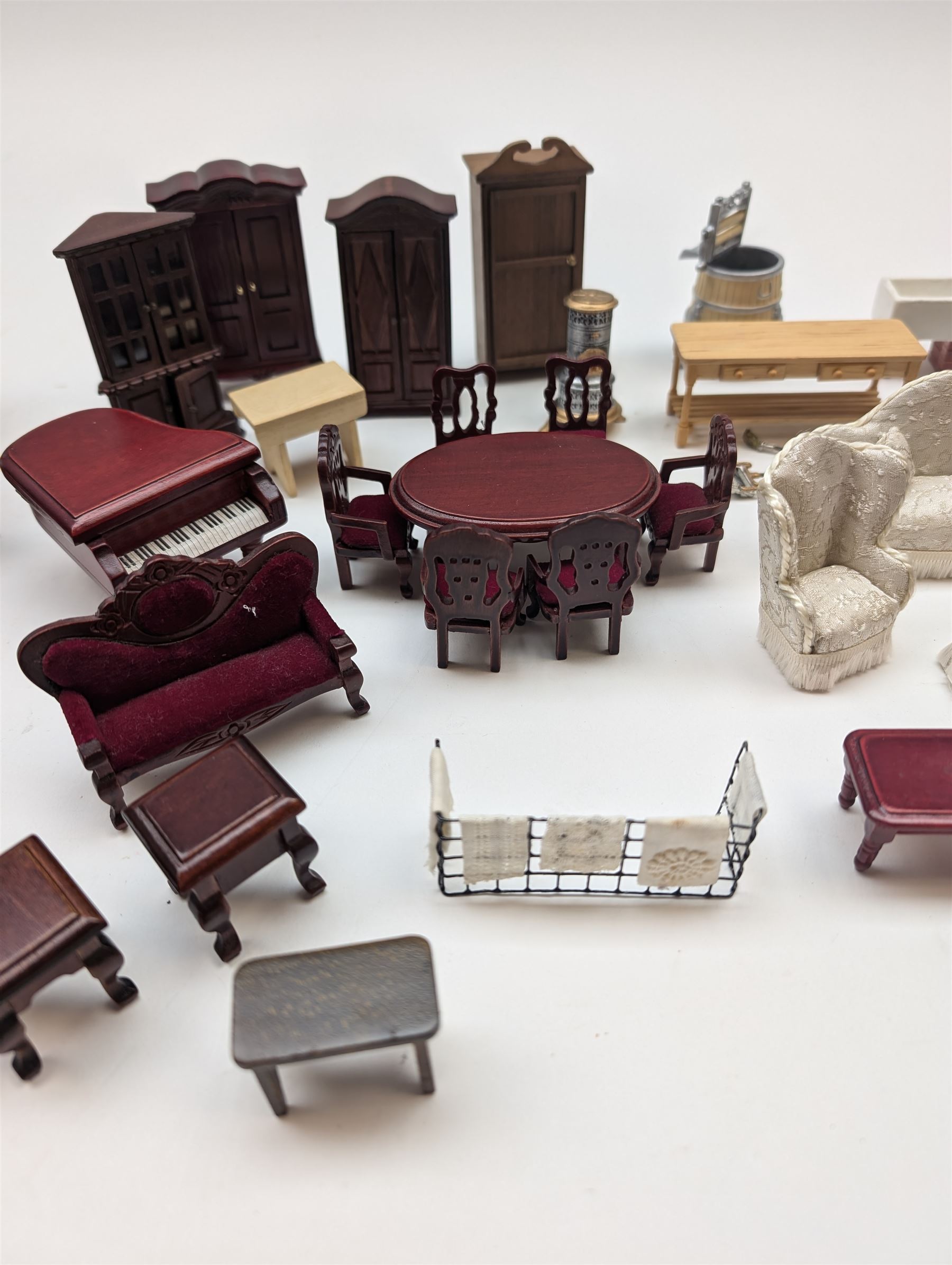 1:24 scale dolls house furniture, comprising stove, mangle, couch and arm chairs, bed, bathroom suite, two dining tables with chairs, side tables, cabinets, dressers, etc 