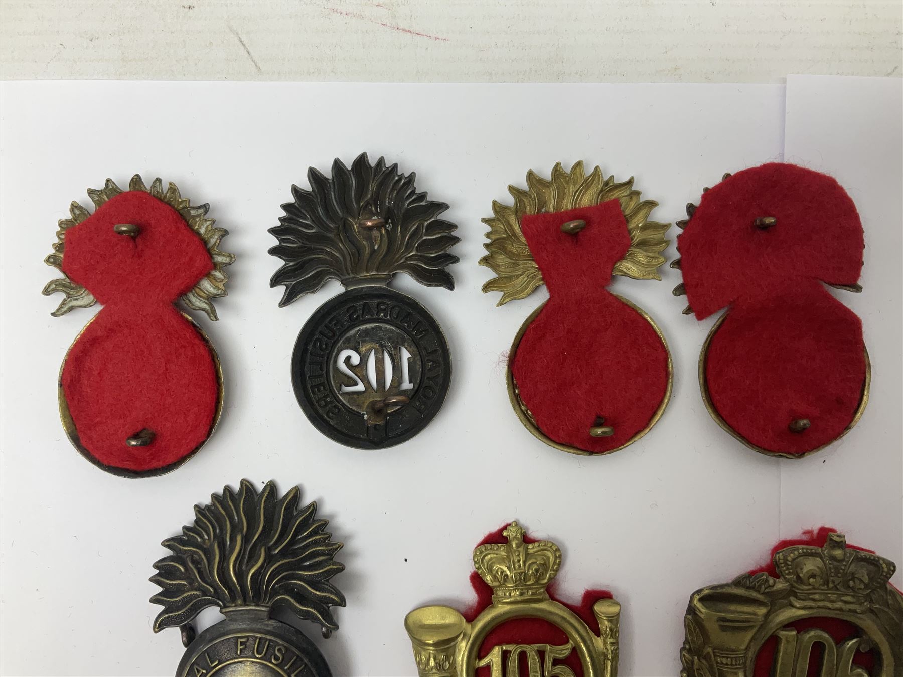 Ten cap badges of Indian interest comprising Bengal Fusiliers No.104, Bengal Infantry No.107, Royal Bengal Fusiliers No.101, Bombay Infantry No.109, Bombay L.I. No.106, two Royal Madras Fusiliers No.102, Madras Infantry No.108 and Madras L.I. No.105 (10)