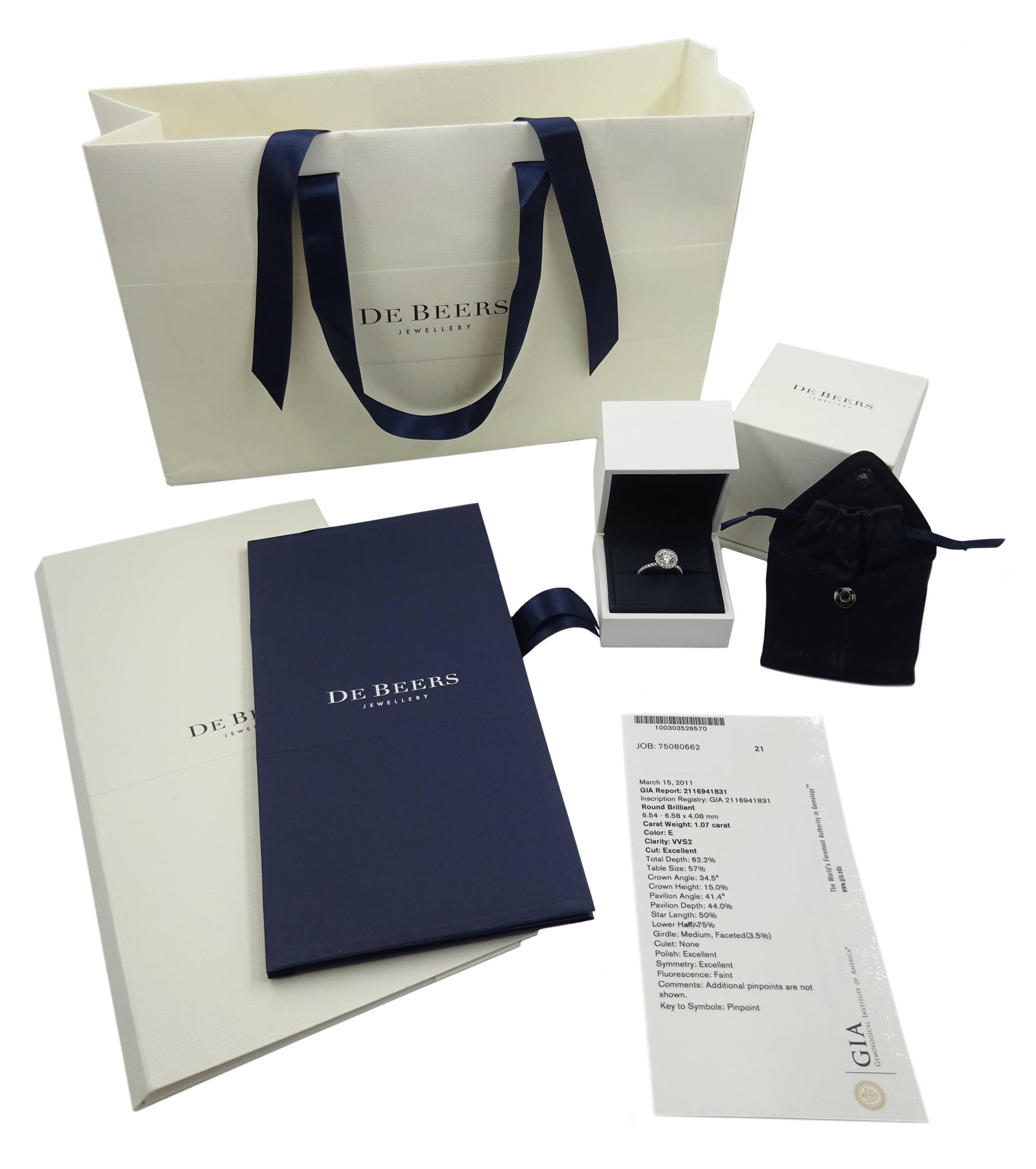 De Beers Aura platinum round brilliant diamond ring, the central diamond solitaire of 1.07 carat, clarity VVS2, colour E, with GIA certificate, surrounded by halo of diamonds and diamond set shoulders, total diamond weight 1.46 carat boxed with authenticity card and purchase receipt dated 2017