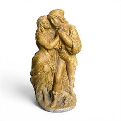 Composite garden statue group of Romeo and Juliet embracing in Medieval dress, surmounted ...