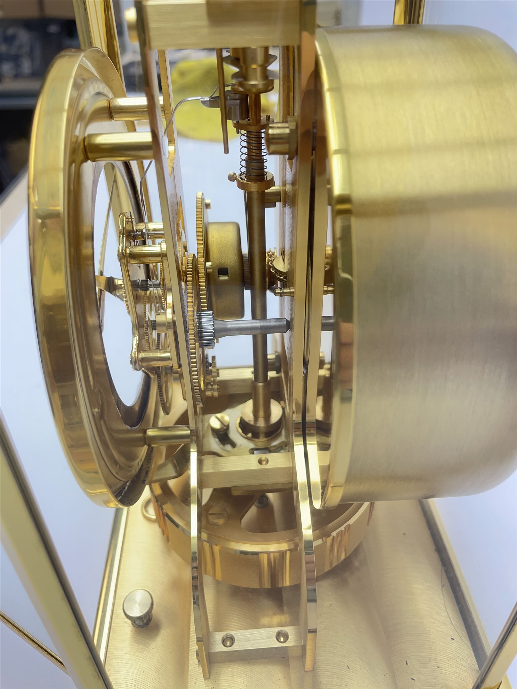 Jaeger-LeCoultre Atmos timepiece clock, in gilt brass and glass case, with wall mount, serial number - 444966