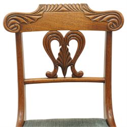 Set of eight (6+2) Regency period mahogany dining chairs, the ornately carved cresting rail of gadrooned and foliate design, over a pierced swan-neck splat with scrolling foliate carving, the carvers with scrolled arm terminals, over teal-upholstered drop-in seats, raised on Gillows-design reeded and tapering front supports, retailed by David Hick Interiors, Jersey