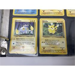 Collection of Pokemon trading cards, mostly 1999 Wizards Pokemon cards to include holo Charizard 4/102, first edition holo Machamp 8/102, further holographic cards; Dark Flareon 35/82 and Dark Vaporeon 45/82, cards from themed sets and 4th edition prints; 1998 Electronic Pokédex with cardboard boxes for themed decks Blackout, Overgrowth and Power Reserve Jungle, along with a large quantity of energy and trainer cards 