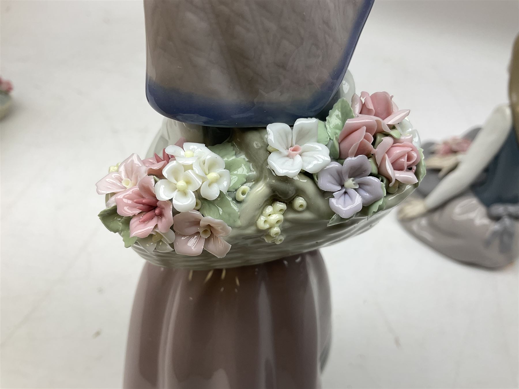 Three Lladro figures, comprising Pondering, no 5173, Nostalgia, no 5071 and Nature's Bounty, no 1417, all with original boxes, largest example H27cm