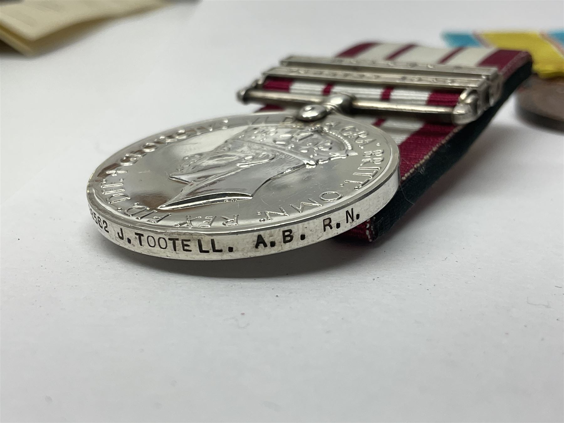 1949 Yangtze Incident HMS Consort casualty Naval General Service Medal with two clasps for Yangtze 1949 and Malaya awarded to D/SSX. 788562 J. Tootell A.B.R.N.; with four other medals comprising Republic of Korea War Service Medal, Eastern Service Medal, unofficial British and Commonwealth Occupation Forces Association Occupation of Japan medal and IFKVWA 40th Anniversary Medal; together with an archive of contemporary and later related items including Certificate of Service 1946-54, Recommendations for Advancement and Conduct Record Sheet 1946-53, Quartermasters History Sheet 1949-53, Destroyer Association China Station 1945-53 beret, later manuscript journal with his own account of the Yangtze incident etc, Joe's birth certificate details dated 1968, reprinted half-length portrait in uniform, Manual of Seamanship 1937, modern shield and framed crests, blazer badges and metal badges and a copy of Loyal & Steadfast - The Story of HMS Consort 2008, which gives details of how Joe Tootell received his wounds, the extract reads ' When Consort came under fire a short time later it was a strange, perhaps unreal experience for many of the crew who had never seen action before. Ordinary Seaman Joe Tootell was in the wheelhouse. 'I could not see the action. We could hear the ship taking severe punishment. When the wheelhouse took a direct hit, killing the coxwain, Chief Petty Officer Gurney, and myself receiving multiple shrapnel wounds, the steering mechanism was put out of action.'