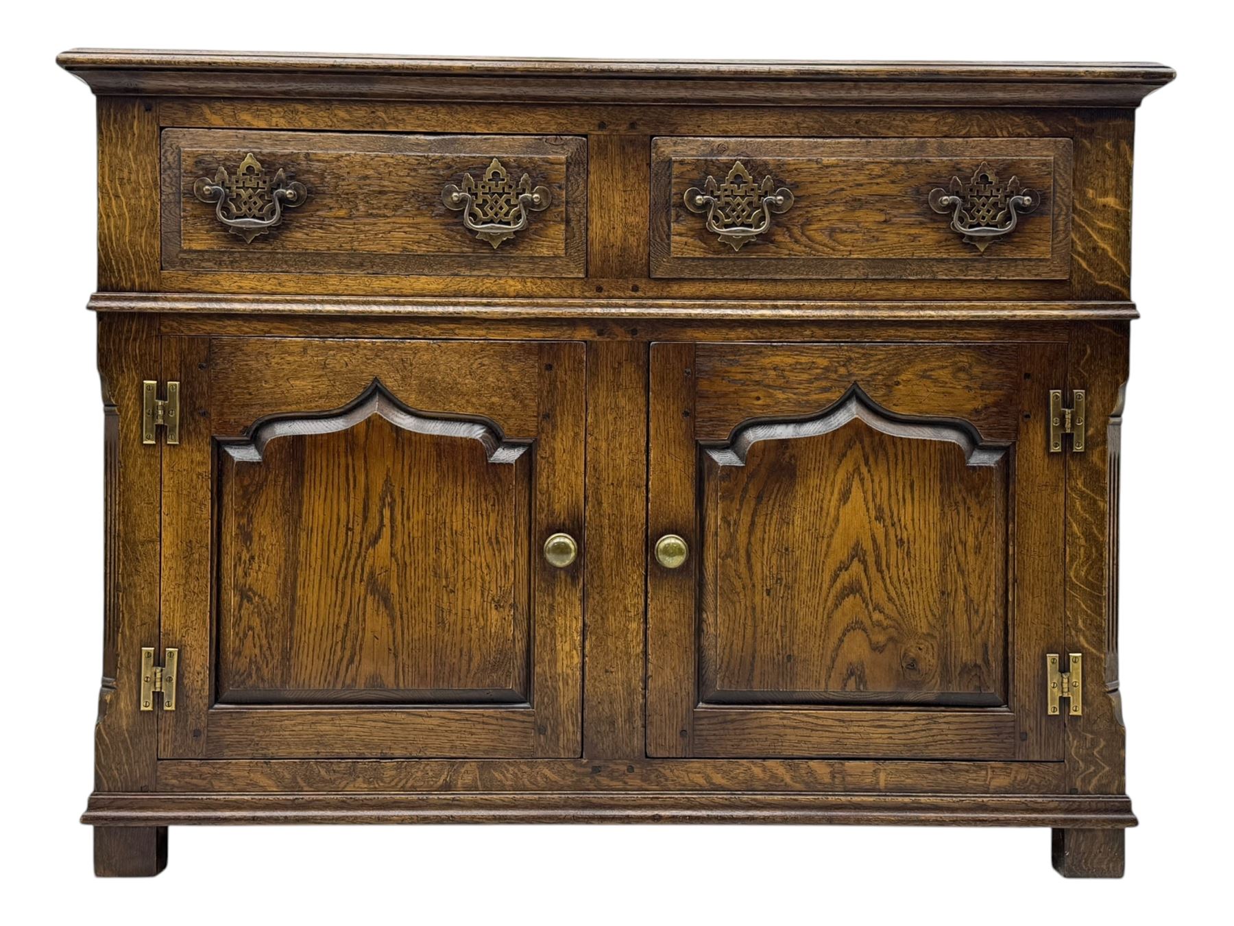 Early 20th century Jacobean design oak dresser sideboard, rectangular top with moulded edge over two baize-lined drawers with pierced handles, above two fielded panel cupboard doors, on stile supports