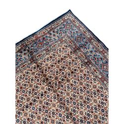Fine Persian Mood blue ground rug, the ivory field decorated with repeating Herati motifs, the guarded border with stylised geometric foliate patterns 