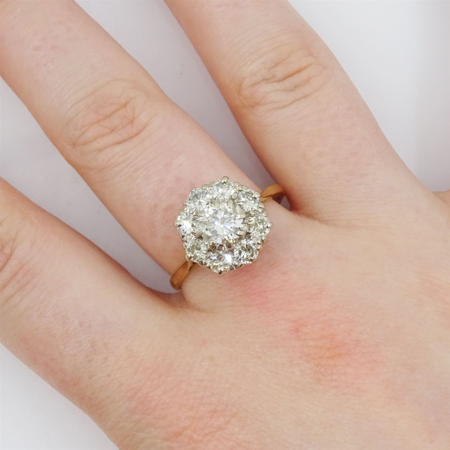 18ct gold round brilliant cut diamond cluster ring, stamped, principal diamond approx 0.70 carat, total diamond weight approx 1.40 carat