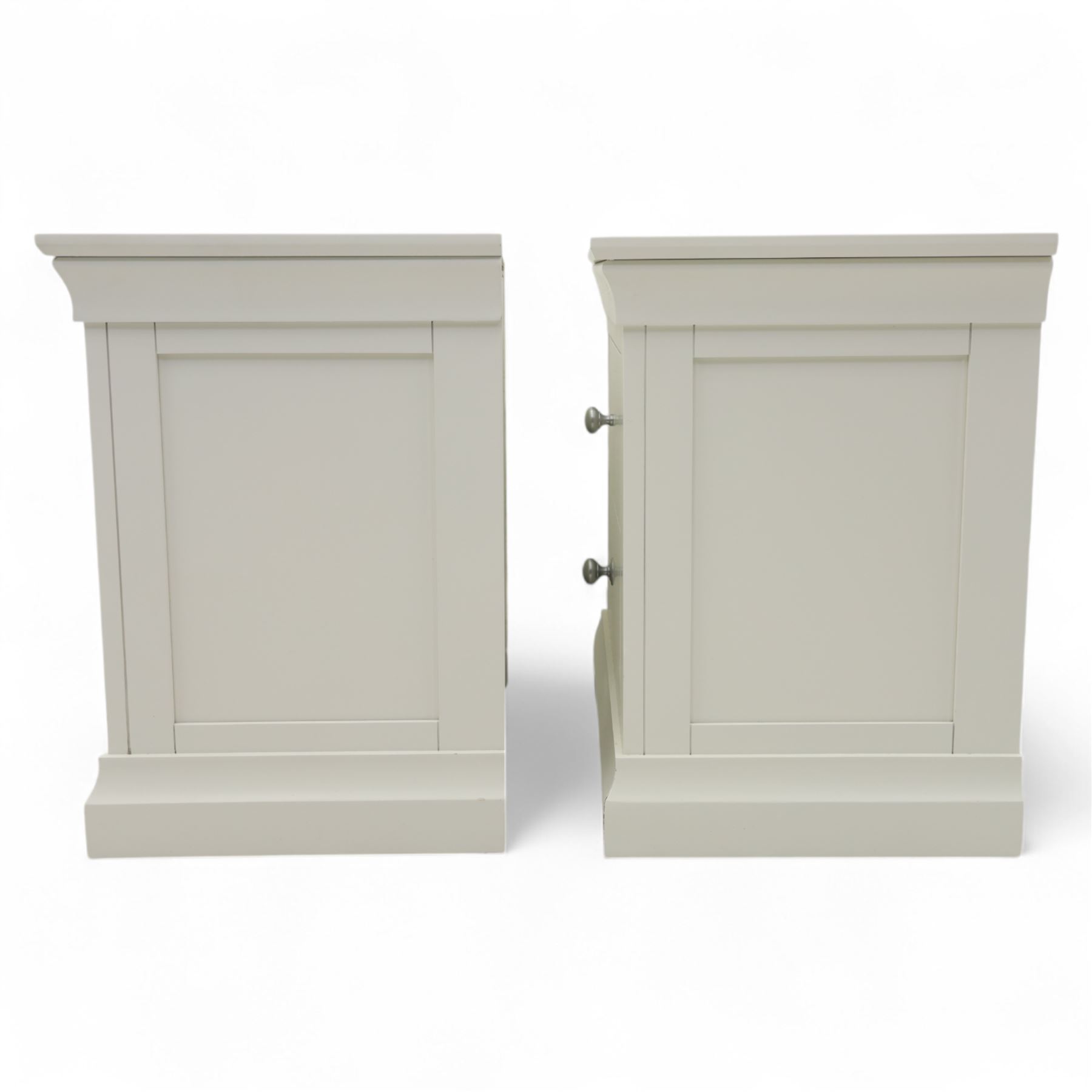 Coxwold Company - pair of white painted jumbo bedside cabinets, with two deep drawers and chrome knob handles,  shaped apron base