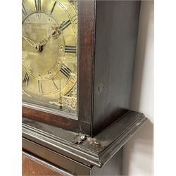 Late 18th century oak longcase clock, projecting cornice over glazed stepped arch hood door, plain rectangular case, the brass dial with circular plate inscribed 'G.H', Roman and Arabic chapter ring, the inner dial decorated with a series of circular motifs, ornate bird and scroll cast spandrels, 30-hour movement striking the hours on bell