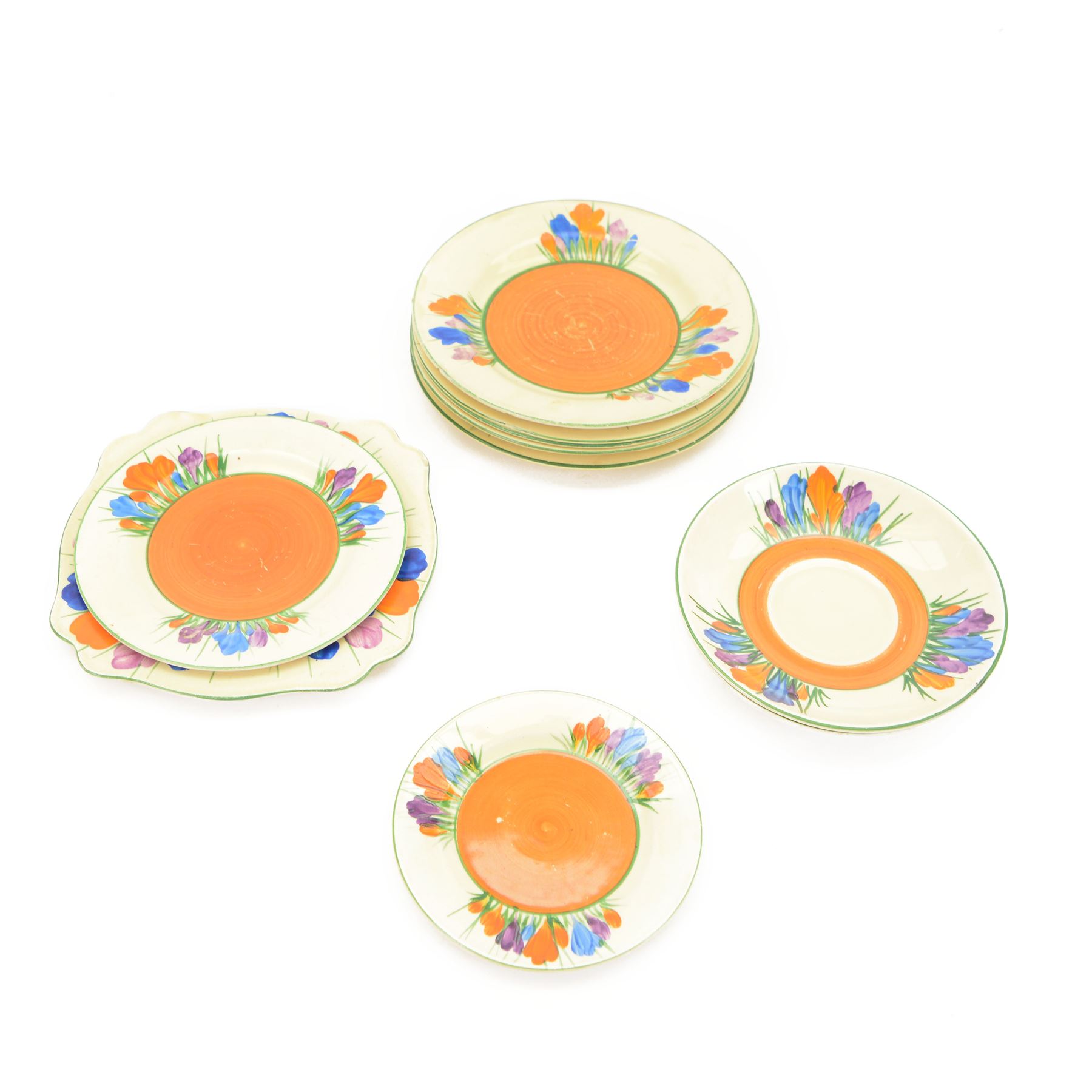 Clarice Cliff Crocus pattern dinner wares, including two teacups and saucers, five side plates, serving plate etc   