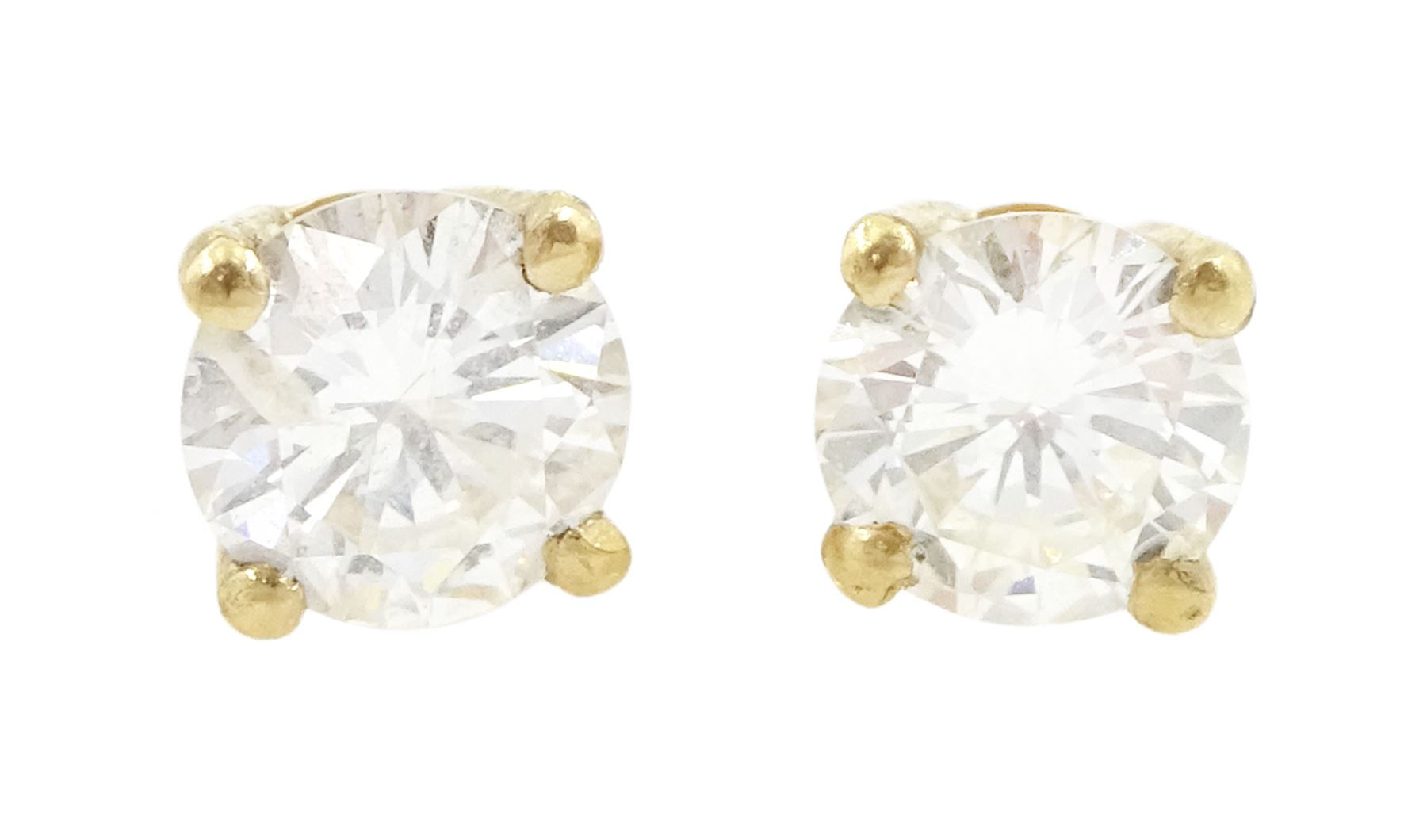 Pair of 18ct gold round brilliant cut diamond stud earrings, stamped, total diamond weight approx 0.65 carat